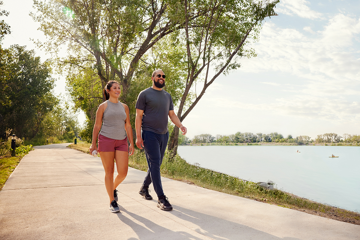 couple walking by lake